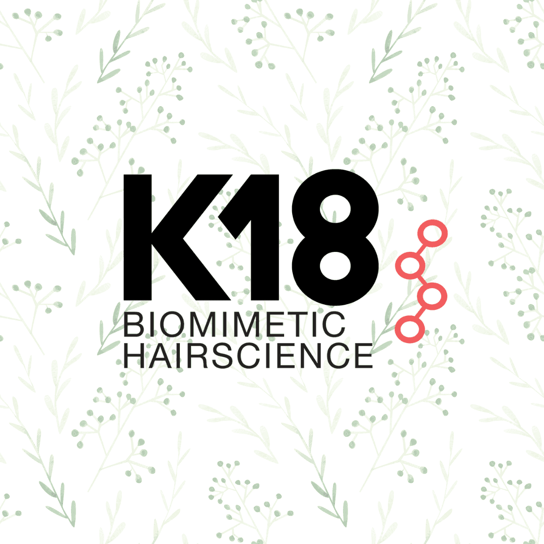 K18 Biomimetic Hairscience logo on a leafy background with a red molecular structure.